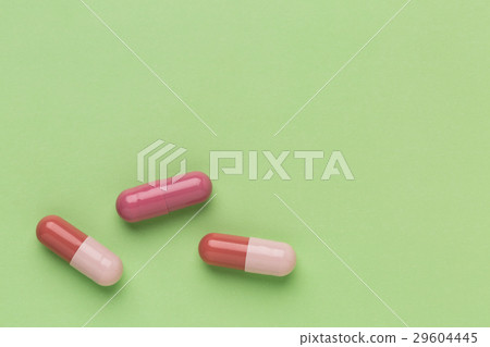 Three brown medicine capsules Three brown medicine capsules 29604445