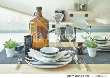 crockery and wine bottle setting on dining table crockery and wine bottle setting on dining table 29604726