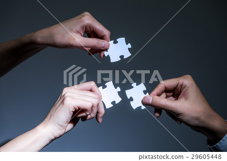 Hand with jigsaw puzzle 29605448