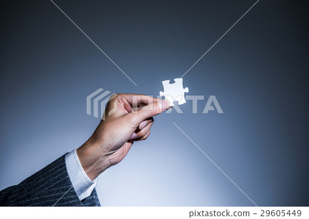 Hand with jigsaw puzzle 29605449