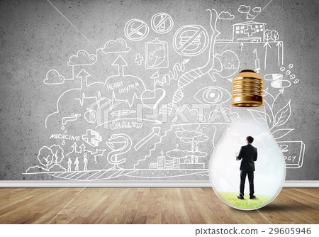 Businessman trapped in bulb Businessman trapped in bulb 29605946