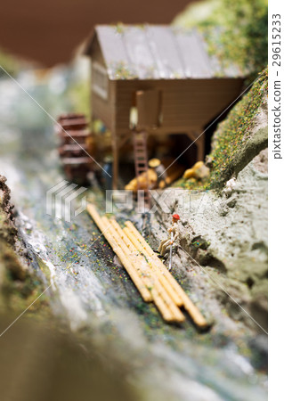 Miniature people: workers on sawmill at the river Miniature people: workers on sawmill at the river 29615233