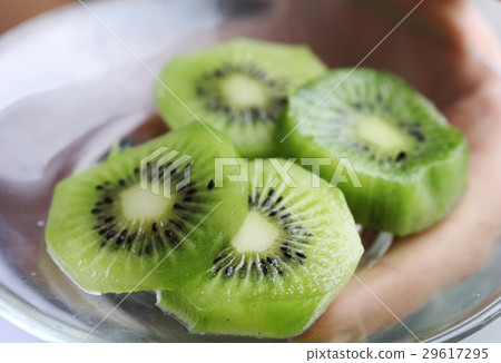 hand hold plate with cut qiwi circles hand hold plate with cut qiwi circles 29617295
