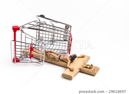 Shopping cart overturned with crucifix on ground Shopping cart overturned with crucifix on ground 29618697