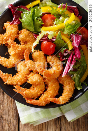 Fried prawns in breadcrumbs and a salad 29623656
