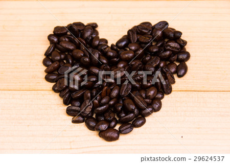 heart coffee beans lay on the brown background heart coffee beans lay on the brown background 29624537