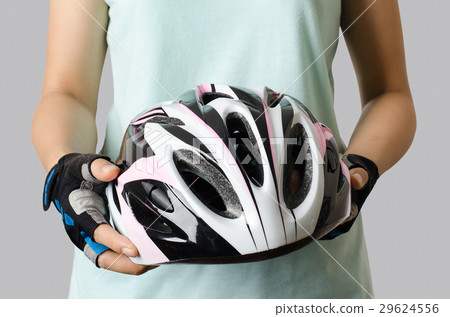 Woman holding bicycle helmet ready to cycling Woman holding bicycle helmet ready to cycling 29624556