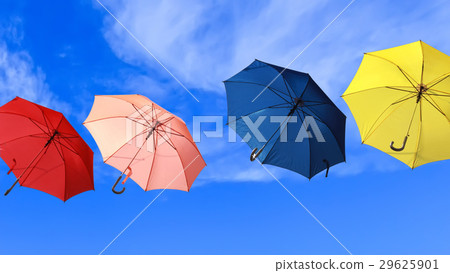 Colorful umbrellas flying into blue sky Colorful umbrellas flying into blue sky 29625901
