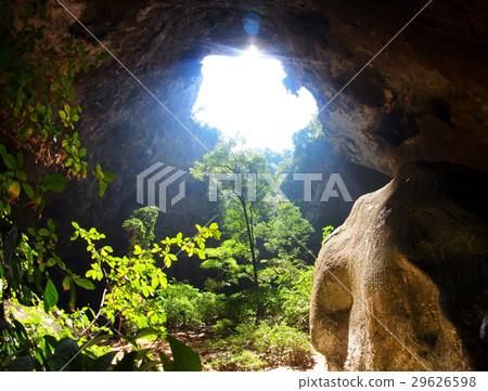 sun light beam through cave hole crop view 29626598