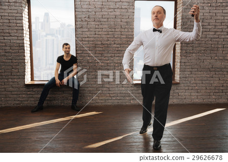 Peaceful dance couch teaching old man at the Peaceful dance couch teaching old man at the 29626678