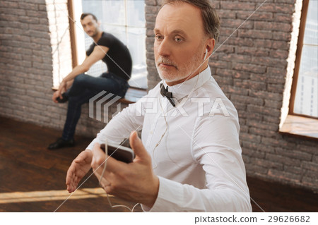 Concentrated pensioner practicing dance art in the 29626682