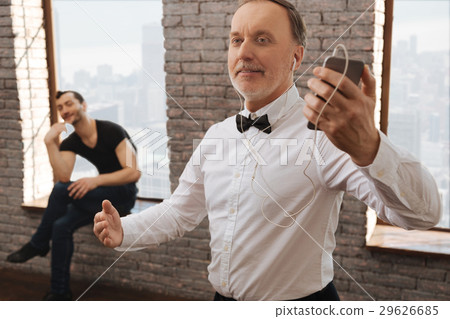 Delighted pensioner enjoying music in the dance 29626685