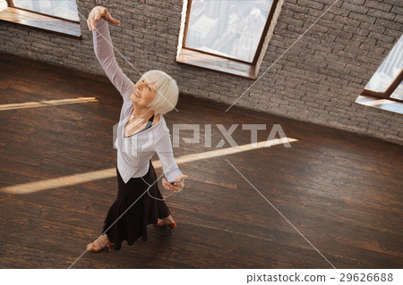 Graceful retired woman performing in the ballroom 29626688