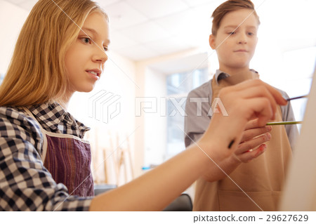 Involved kids painting in the art school 29627629