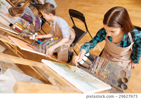 Joyful friends painting in the art school 29627673
