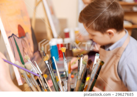 Diligent boy having art class in the school Diligent boy having art class in the school 29627685