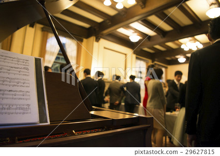 Piano performance at the dinner party 29627815