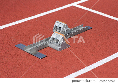 Athletics starting blocks on race red track 29627898