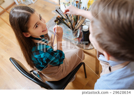 Upbeat friends painting in the art studio Upbeat friends painting in the art studio 29628634