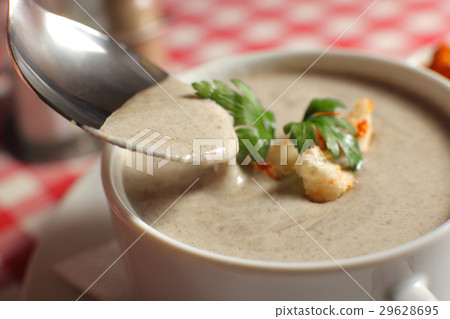 Bowl of cream soup with champignon mushrooms on Bowl of cream soup with champignon mushrooms on 29628695