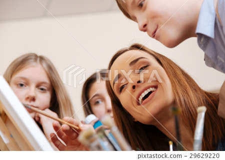 Delighted teacher having lesson in the art studio 29629220