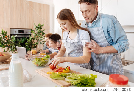 Pleasant caring father teaching his daughter to Pleasant caring father teaching his daughter to 29630058