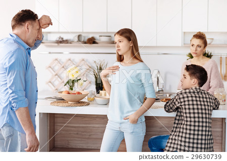 Serious father and daughter quarrelling Serious father and daughter quarrelling 29630739