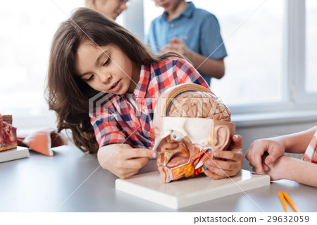 Adorable determined student concentrating on the 29632059