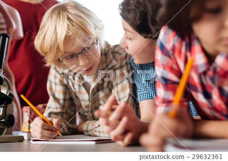 Intelligent dedicated children discussing 29632361