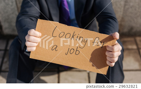 Close up of cardboard being in male hands 29632821