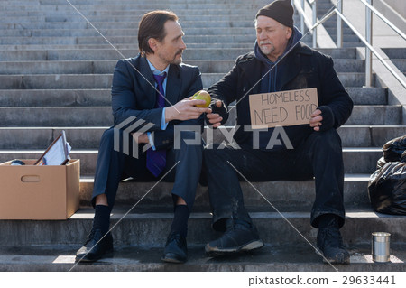 Jobless and homeless sitting next to each other Jobless and homeless sitting next to each other 29633441