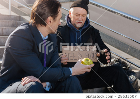 Homeless person looking at tasty fruit Homeless person looking at tasty fruit 29633507