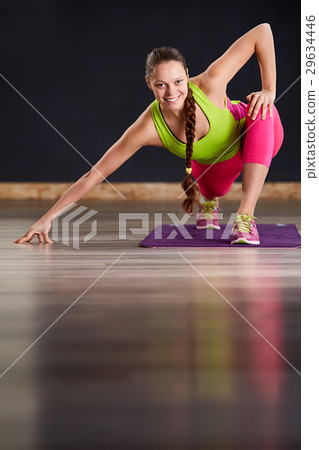 Young slim woman in yoga class making beautiful Young slim woman in yoga class making beautiful 29634446