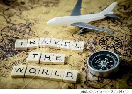 Travel the world concept text and equipment on map 29634561