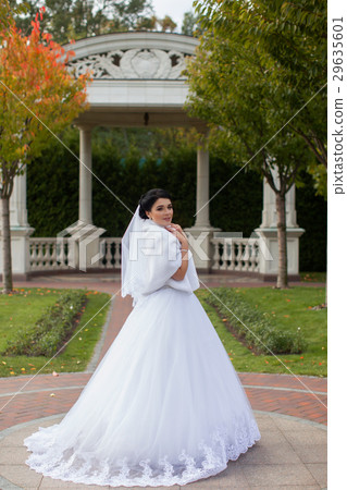 Bride on a promenade in a summer park Bride on a promenade in a summer park 29635601