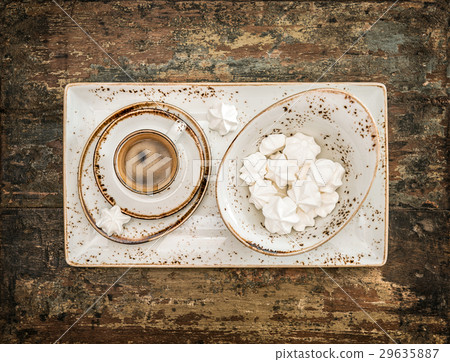 Black coffee with meringue cookies. Retro style  29635887