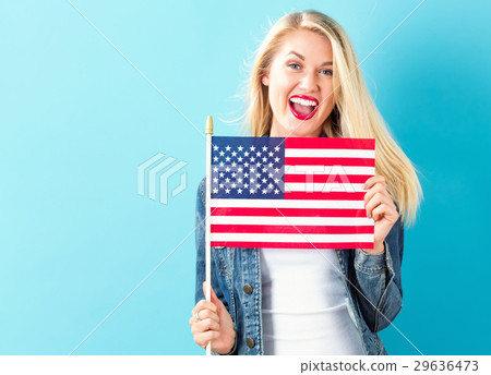 Young woman holding American flag 29636473