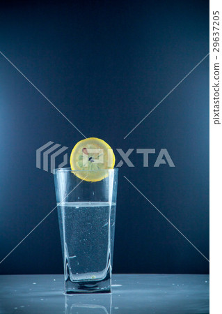 slice of lemon drops in a glass of water slice of lemon drops in a glass of water 29637205
