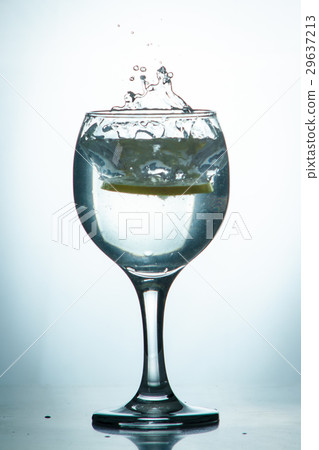 slice of lemon drops in a glass of water slice of lemon drops in a glass of water 29637213