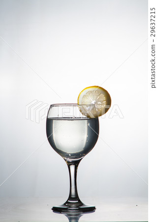 slice of lemon drops in a glass of water slice of lemon drops in a glass of water 29637215