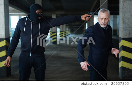 Worried unhappy businessman trying to run away Worried unhappy businessman trying to run away 29637893