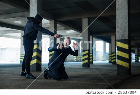 Sad scared businessman falling on his knees Sad scared businessman falling on his knees 29637894