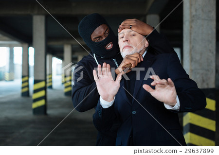 Angry aggressive man holding a knife 29637899