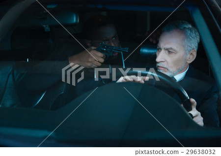Nice pleasant man having a criminal in his car Nice pleasant man having a criminal in his car 29638032