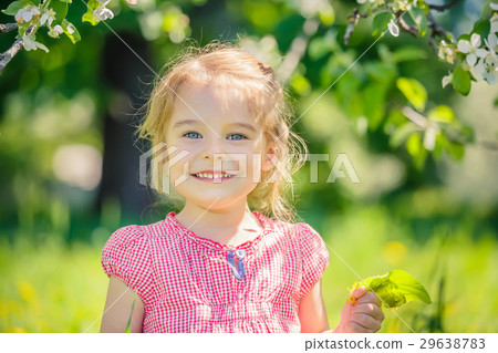 Happy little girl in apple tree garden 29638783