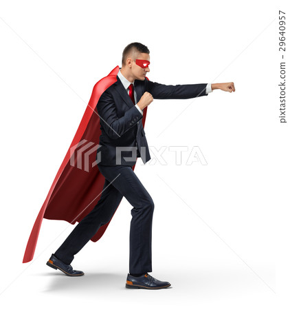 A businessman in a superhero red cape and a mask A businessman in a superhero red cape and a mask 29640957