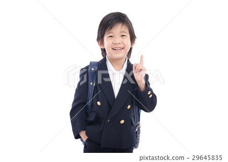 Asian child in school uniform with blue school bag Asian child in school uniform with blue school bag 29645835
