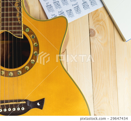Guitar with Musical notebook for song writing. 29647434