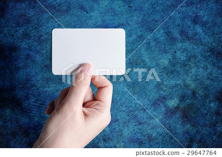 Woman hand holding blank business card 29647764