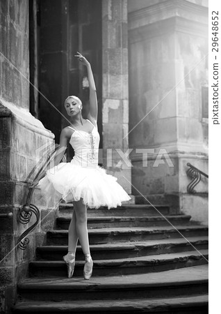 Young ballerina woman posing on stairs 29648652